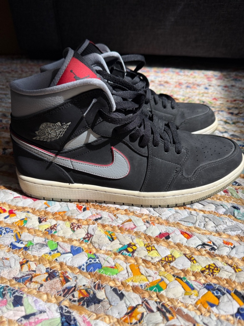 Nike Air Jordan 1 Mid sneakers in a Black/Particle Grey-White colorway